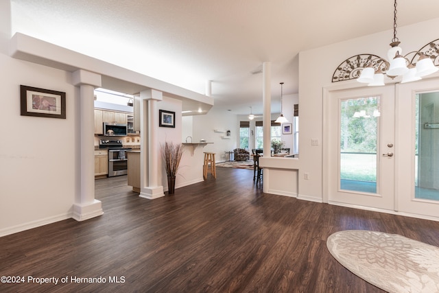 entrance foyer featuring french doors and dark hardwood / wood-style flooring