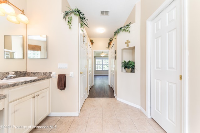 bathroom with vanity and tile patterned floors