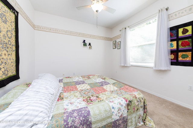 carpeted bedroom with ceiling fan