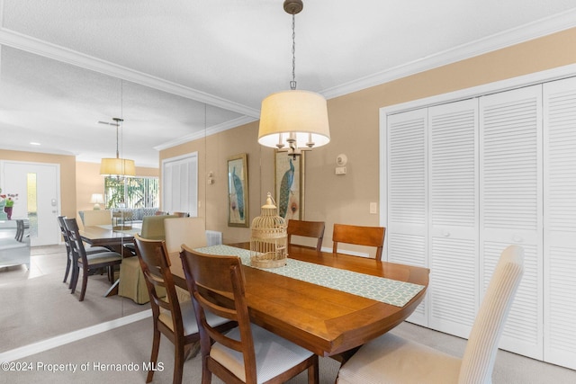 dining space featuring ornamental molding