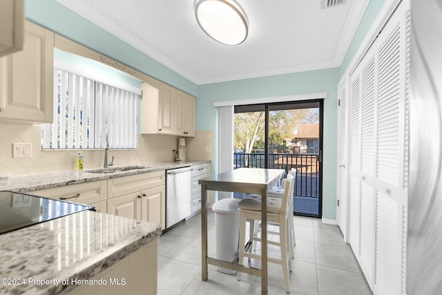 kitchen featuring light stone counters, crown molding, light tile patterned floors, decorative backsplash, and stainless steel dishwasher