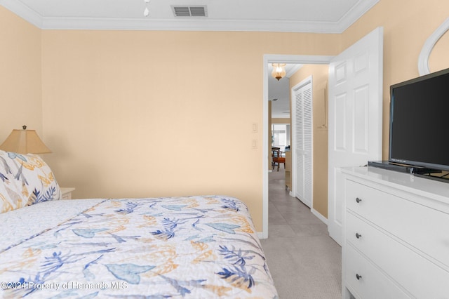 bedroom with light carpet and crown molding