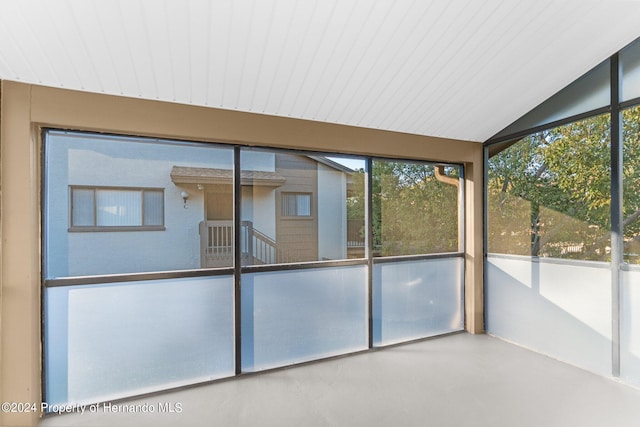 unfurnished sunroom with vaulted ceiling