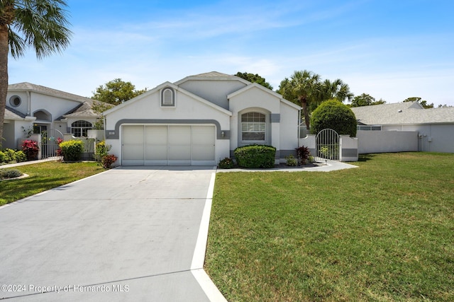 single story home with a garage and a front yard