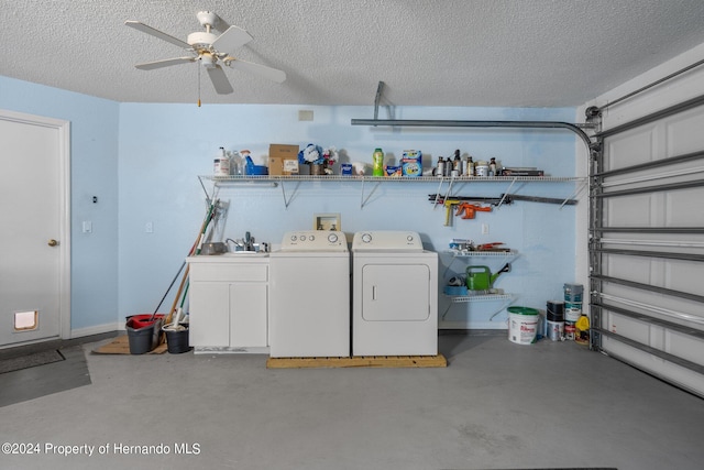 washroom with cabinets, sink, ceiling fan, a textured ceiling, and washer and dryer