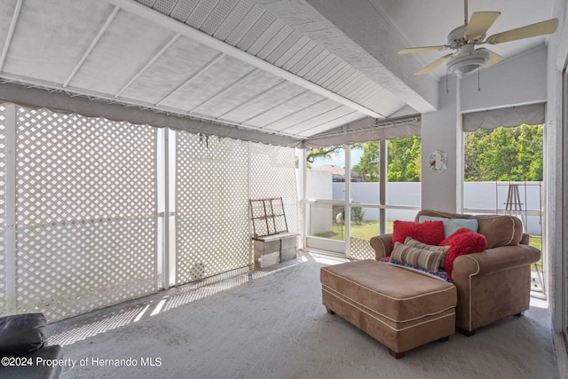 sunroom / solarium with vaulted ceiling with beams and ceiling fan