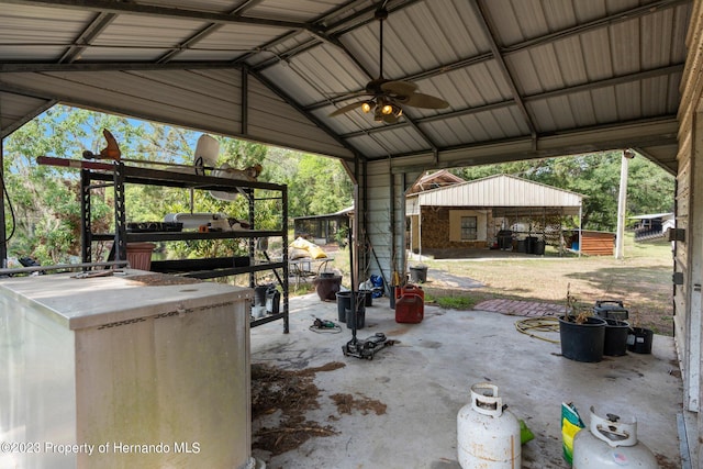 view of patio featuring an outdoor structure and ceiling fan