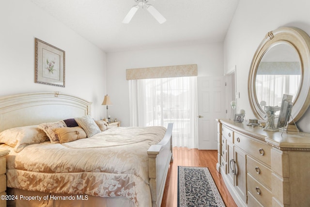 bedroom with ceiling fan and light hardwood / wood-style floors