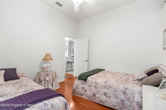 bedroom with wood-type flooring and ceiling fan