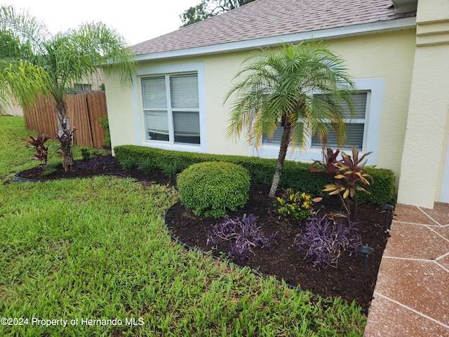 view of home's exterior featuring a yard