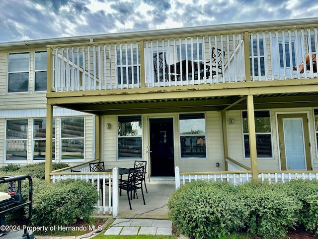 rear view of property featuring a patio