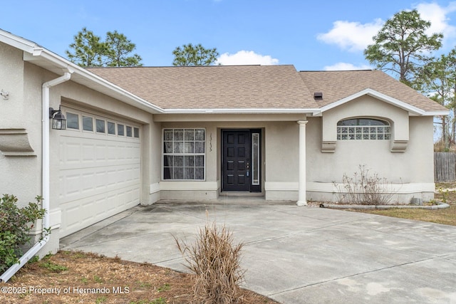 entrance to property featuring a garage