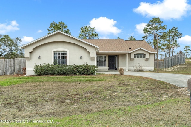 ranch-style home with a front lawn