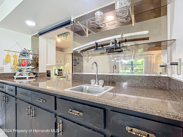 kitchen featuring gray cabinets and sink