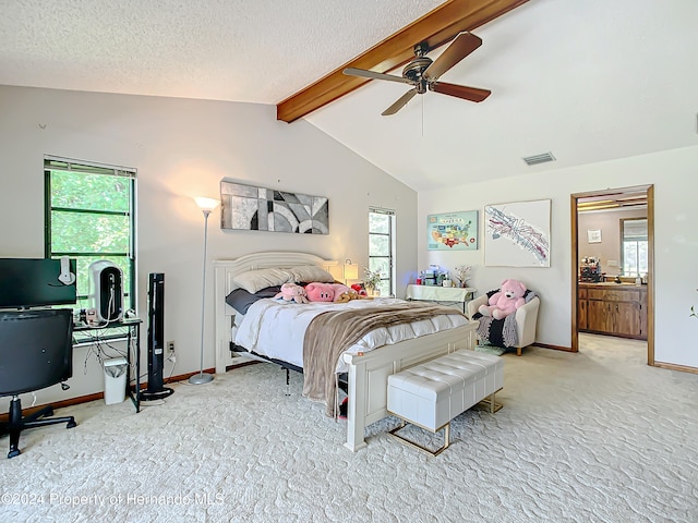 carpeted bedroom featuring ceiling fan, multiple windows, and lofted ceiling with beams