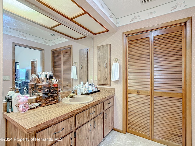 bathroom featuring vanity and a textured ceiling