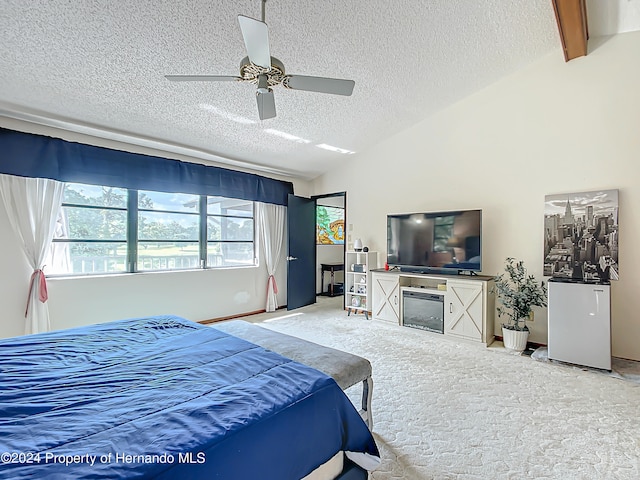 bedroom with ceiling fan, a textured ceiling, vaulted ceiling with beams, and carpet