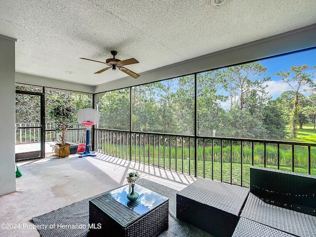 sunroom / solarium with ceiling fan