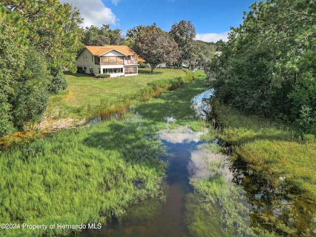 birds eye view of property featuring a water view