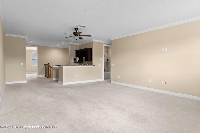 unfurnished living room featuring light carpet, crown molding, and ceiling fan