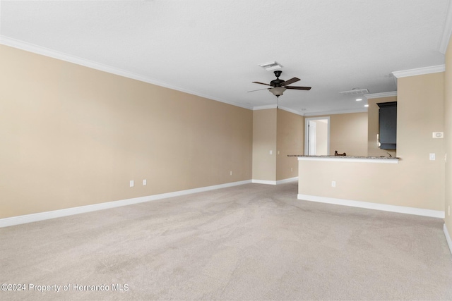 unfurnished living room featuring ceiling fan, carpet, and ornamental molding