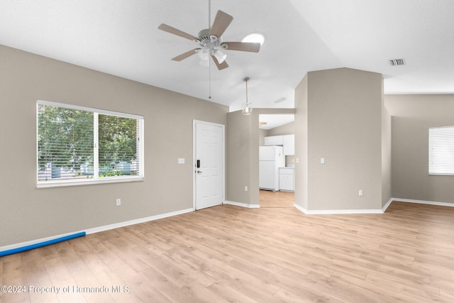 unfurnished living room featuring ceiling fan, light wood-type flooring, and vaulted ceiling