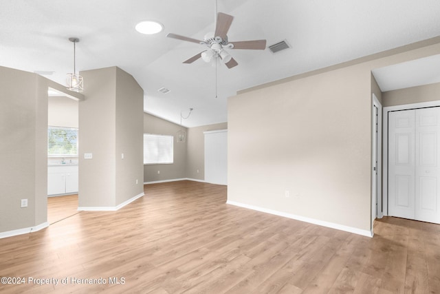 unfurnished living room featuring light hardwood / wood-style floors, ceiling fan, lofted ceiling, and sink