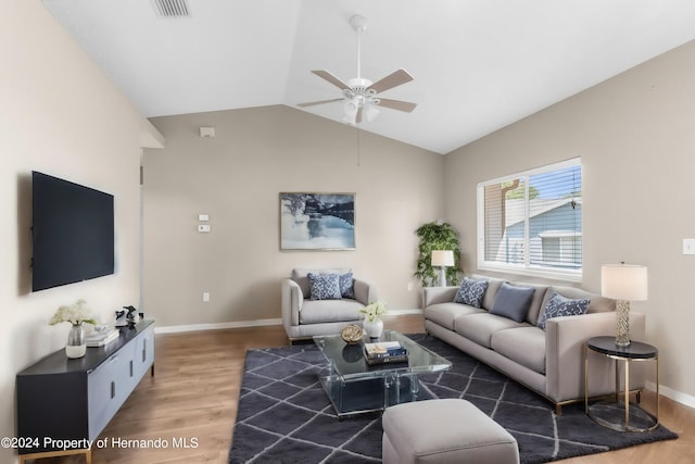 living room featuring ceiling fan, wood-type flooring, and lofted ceiling