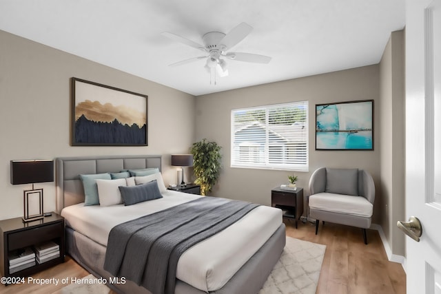 bedroom featuring ceiling fan and light wood-type flooring