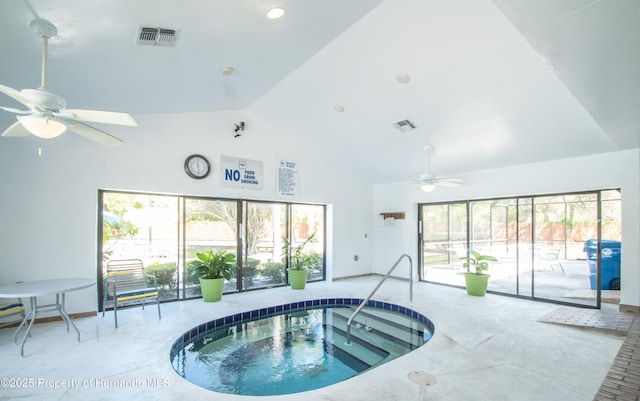 view of pool with ceiling fan and an indoor hot tub