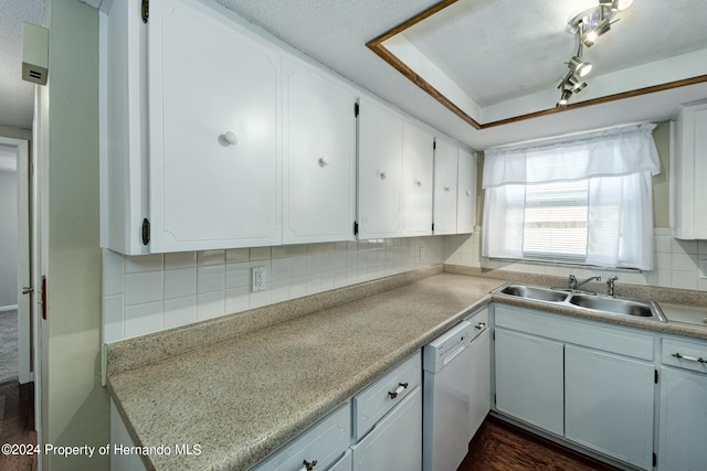 kitchen with dishwasher, white cabinetry, dark hardwood / wood-style flooring, and decorative backsplash