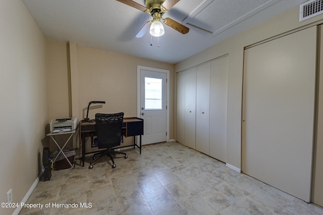 office area featuring a textured ceiling and ceiling fan