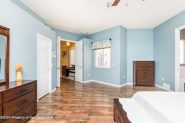 bedroom with ceiling fan and dark hardwood / wood-style flooring