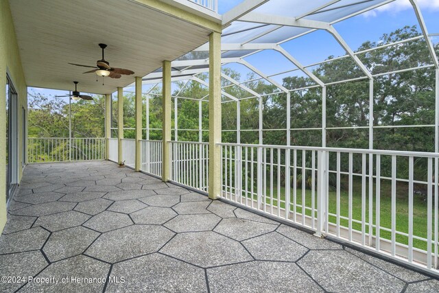 view of patio / terrace with glass enclosure and ceiling fan