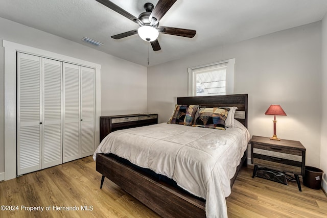 6635 Stewart Ave N, Saint Petersburg, FL 33702 - bedroom featuring wood finished floors, a closet, and ceiling fan