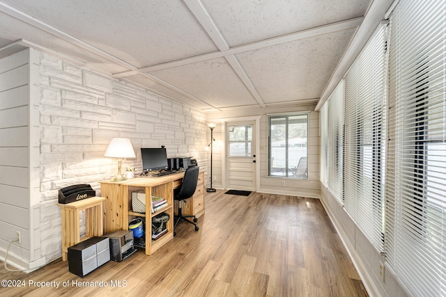 office with wood-type flooring and coffered ceiling