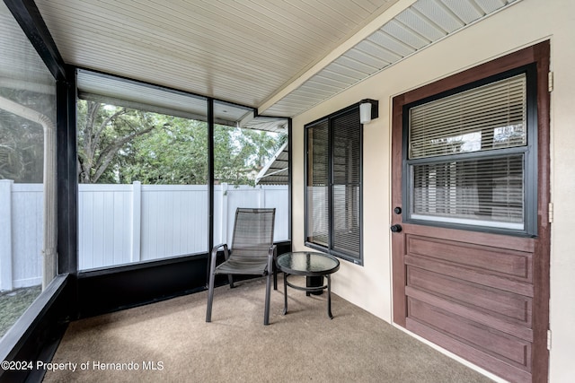 sunroom / solarium with beamed ceiling