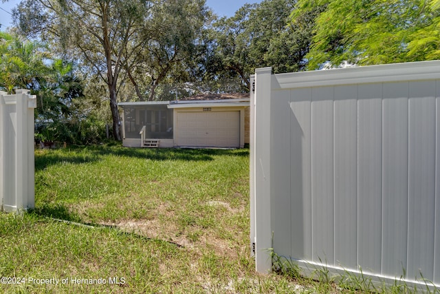 view of yard featuring a garage