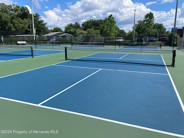 6635 Stewart Ave N, Saint Petersburg, FL 33702 - view of tennis court featuring community basketball court and fence