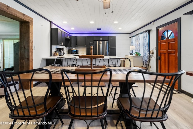 interior space featuring ceiling fan, wooden ceiling, crown molding, and light hardwood / wood-style flooring