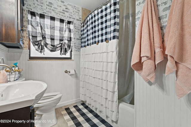 full bathroom with shower / bath combo, vanity, and toilet