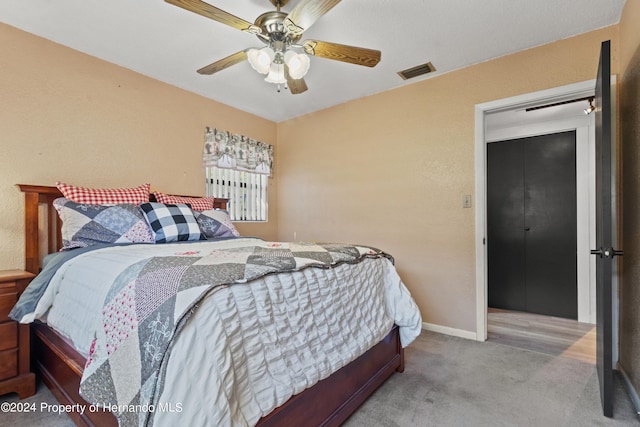 carpeted bedroom with ceiling fan