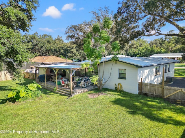 view of yard featuring cooling unit and a patio