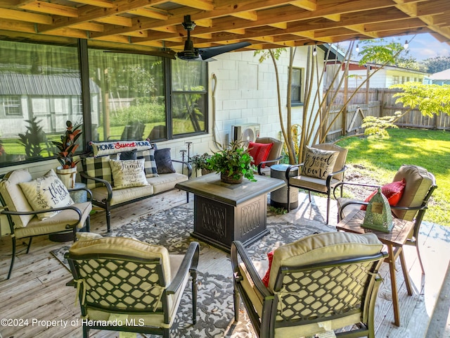 view of patio with ceiling fan, a wooden deck, and an outdoor hangout area