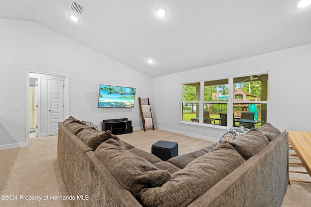 living room featuring light colored carpet and lofted ceiling