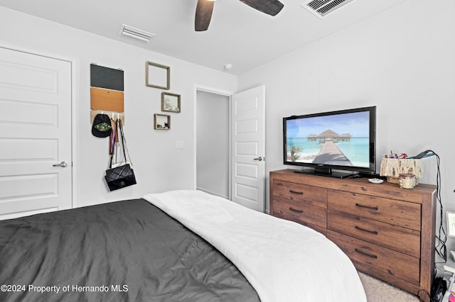 carpeted bedroom with ceiling fan