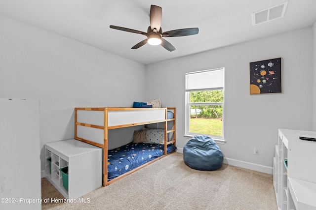 carpeted bedroom with ceiling fan