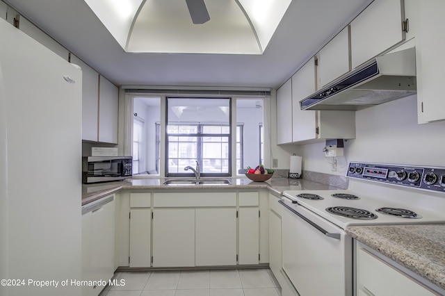 kitchen featuring white cabinetry, sink, white appliances, and light tile patterned flooring