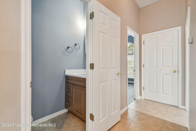 bathroom with vanity and tile patterned floors