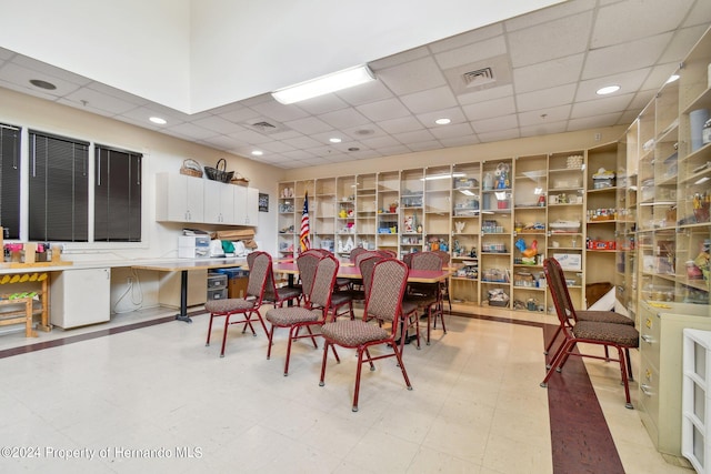 dining room with a drop ceiling